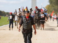 Members of the Muwekma Ohlone Tribe of the San Francisco Bay Area, along with other tribal groups and their supporters, march along the Nati...