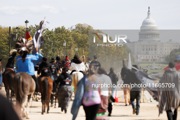 Members of the Muwekma Ohlone Tribe of the San Francisco Bay Area, along with other tribal groups and their supporters, march along the Nati...