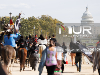 Members of the Muwekma Ohlone Tribe of the San Francisco Bay Area, along with other tribal groups and their supporters, march along the Nati...