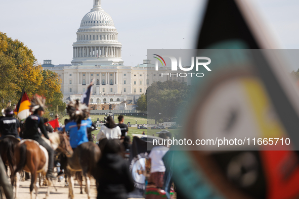 Members of the Muwekma Ohlone Tribe of the San Francisco Bay Area, along with other tribal groups and their supporters, march along the Nati...