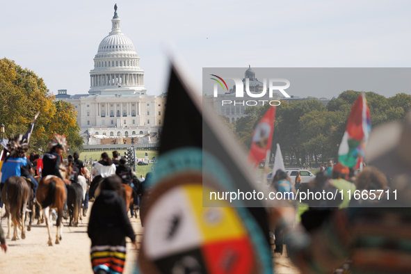 Members of the Muwekma Ohlone Tribe of the San Francisco Bay Area, along with other tribal groups and their supporters, march along the Nati...