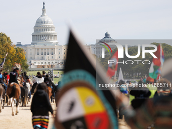 Members of the Muwekma Ohlone Tribe of the San Francisco Bay Area, along with other tribal groups and their supporters, march along the Nati...