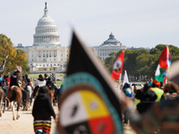 Members of the Muwekma Ohlone Tribe of the San Francisco Bay Area, along with other tribal groups and their supporters, march along the Nati...