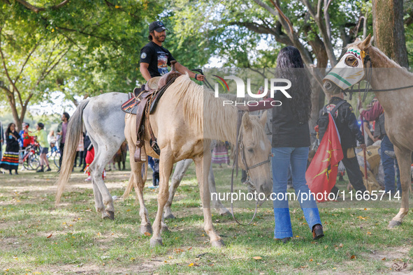 Members of the Muwekma Ohlone Tribe of the San Francisco Bay Area, along with other tribal groups and their supporters, arrive on horseback...