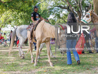 Members of the Muwekma Ohlone Tribe of the San Francisco Bay Area, along with other tribal groups and their supporters, arrive on horseback...