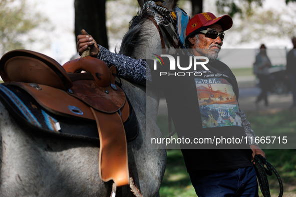 Members of the Muwekma Ohlone Tribe of the San Francisco Bay Area, along with other tribal groups and their supporters, arrive on horseback...