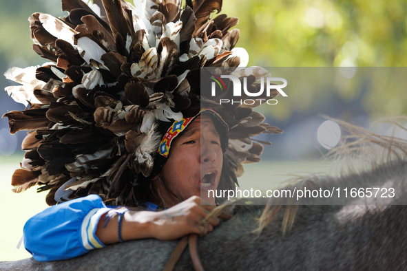 Members of the Muwekma Ohlone Tribe of the San Francisco Bay Area, along with other tribal groups and their supporters, arrive on horseback...