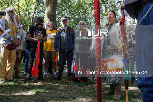 A woman speaks as members of the Muwekma Ohlone Tribe of the San Francisco Bay Area, along with other tribal groups and their supporters, ar...