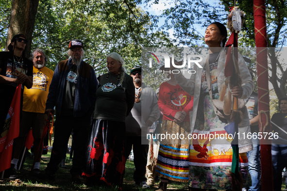 A woman speaks as members of the Muwekma Ohlone Tribe of the San Francisco Bay Area, along with other tribal groups and their supporters, ar...