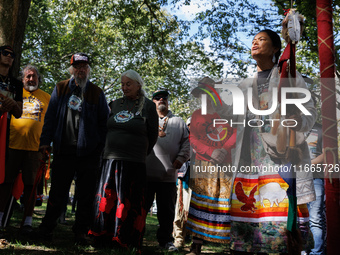 A woman speaks as members of the Muwekma Ohlone Tribe of the San Francisco Bay Area, along with other tribal groups and their supporters, ar...