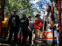 A woman speaks as members of the Muwekma Ohlone Tribe of the San Francisco Bay Area, along with other tribal groups and their supporters, ar...