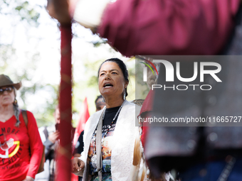 A woman speaks as members of the Muwekma Ohlone Tribe of the San Francisco Bay Area, along with other tribal groups and their supporters, ar...