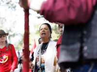 A woman speaks as members of the Muwekma Ohlone Tribe of the San Francisco Bay Area, along with other tribal groups and their supporters, ar...