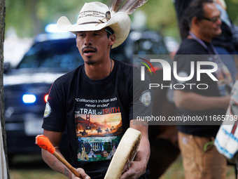 Members of the Muwekma Ohlone Tribe of the San Francisco Bay Area, along with other tribal groups and their supporters, arrive on horseback...