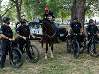 U.S. Capitol Police officers speak with members of the Muwekma Ohlone Tribe of the San Francisco Bay Area, after the group arrived on horseb...