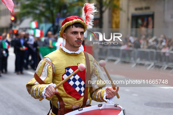 Performers in costume pose for a photo during the Columbus Day Parade in New York City, United States, on October 14, 2024. 