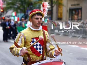 Performers in costume pose for a photo during the Columbus Day Parade in New York City, United States, on October 14, 2024. (