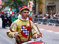 Performers in costume pose for a photo during the Columbus Day Parade in New York City, United States, on October 14, 2024. (