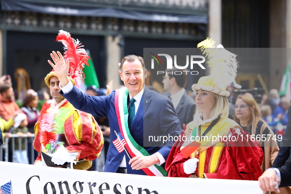 Congressman Thomas Suozzi marches up 5th Avenue in the Columbus Day Parade in New York City, United States, on October 14, 2024. 