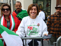 Spectators wave flags and show off Italian heritage as they march up 5th Avenue in the Columbus Day Parade in New York City, United States,...