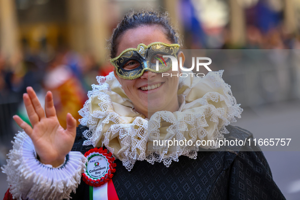 Performers in costume pose for a photo during the Columbus Day Parade in New York City, United States, on October 14, 2024. 