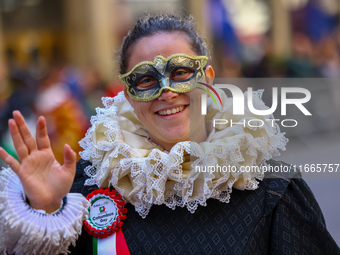 Performers in costume pose for a photo during the Columbus Day Parade in New York City, United States, on October 14, 2024. (