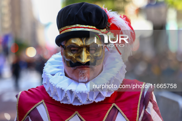 Performers in costume pose for a photo during the Columbus Day Parade in New York City, United States, on October 14, 2024. 