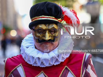 Performers in costume pose for a photo during the Columbus Day Parade in New York City, United States, on October 14, 2024. (