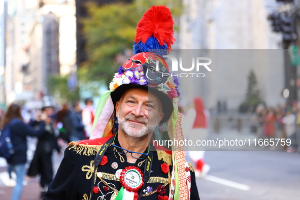 Performers in costume pose for a photo during the Columbus Day Parade in New York City, United States, on October 14, 2024. 