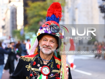 Performers in costume pose for a photo during the Columbus Day Parade in New York City, United States, on October 14, 2024. (