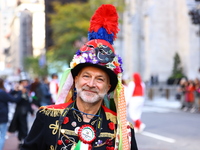 Performers in costume pose for a photo during the Columbus Day Parade in New York City, United States, on October 14, 2024. (