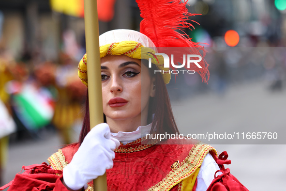 Performers in costume pose for a photo during the Columbus Day Parade in New York City, United States, on October 14, 2024. 