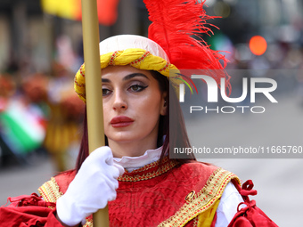 Performers in costume pose for a photo during the Columbus Day Parade in New York City, United States, on October 14, 2024. (