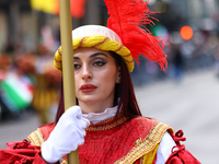 Performers in costume pose for a photo during the Columbus Day Parade in New York City, United States, on October 14, 2024. (