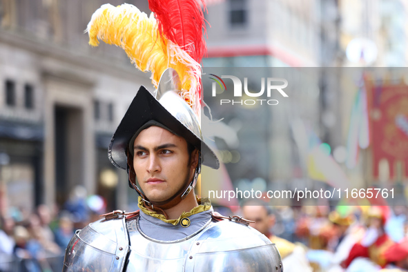 Performers in costume pose for a photo during the Columbus Day Parade in New York City, United States, on October 14, 2024. 