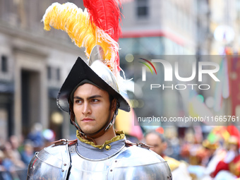 Performers in costume pose for a photo during the Columbus Day Parade in New York City, United States, on October 14, 2024. (