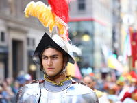 Performers in costume pose for a photo during the Columbus Day Parade in New York City, United States, on October 14, 2024. (