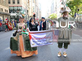 Performers in costume pose for a photo during the Columbus Day Parade in New York City, United States, on October 14, 2024. (