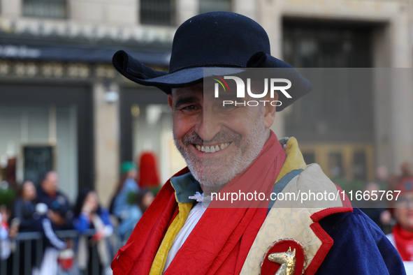 Performers in costume pose for a photo during the Columbus Day Parade in New York City, United States, on October 14, 2024. 