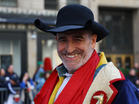 Performers in costume pose for a photo during the Columbus Day Parade in New York City, United States, on October 14, 2024. (