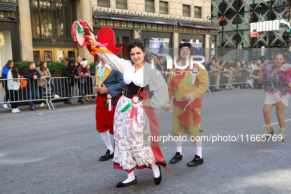 Performers in costume pose for a photo during the Columbus Day Parade in New York City, United States, on October 14, 2024. 