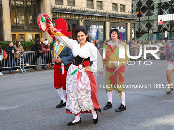 Performers in costume pose for a photo during the Columbus Day Parade in New York City, United States, on October 14, 2024. (