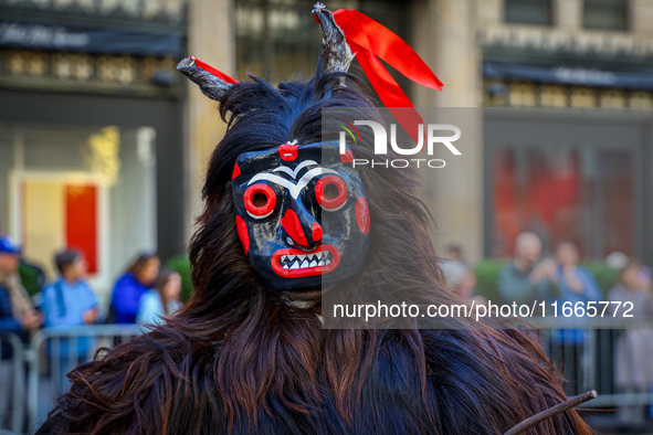 Performers in costume pose for a photo during the Columbus Day Parade in New York City, United States, on October 14, 2024. 