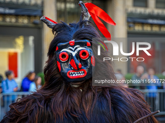 Performers in costume pose for a photo during the Columbus Day Parade in New York City, United States, on October 14, 2024. (