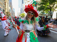 Performers in costume pose for a photo during the Columbus Day Parade in New York City, United States, on October 14, 2024. (