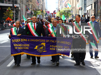 The Order Sons & Daughters of Italy in America march while heading up 5th Avenue in the Columbus Day Parade in New York City, United States,...