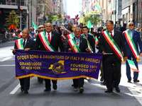 The Order Sons & Daughters of Italy in America march while heading up 5th Avenue in the Columbus Day Parade in New York City, United States,...