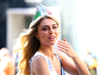 Miss World Italy Lucrezia Mangilli waves to crowds while heading up 5th Avenue in the Columbus Day Parade in New York City, United States, o...