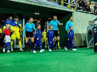 Referees officiate a match of the UEFA Nations League between the Ukraine and Czechia national teams in Wroclaw, Poland, on October 14, 2024...