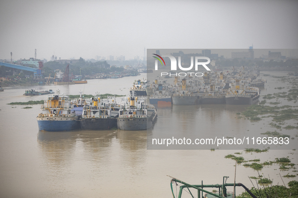 Cargo ships anchor in the Shitalakkhya River in Dhaka, Bangladesh, on October 14, 2024. 